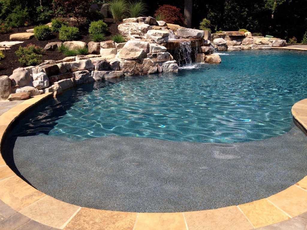 Concrete Pool Waterfalls-Tampa Custom Concrete Pros-We offer custom concrete solutions, Polished concrete, Stained concrete, Epoxy Floor, Sealed concrete, Stamped concrete, Concrete overlay, Concrete countertops, Concrete summer kitchens, Driveway repairs, Concrete pool water falls, and more