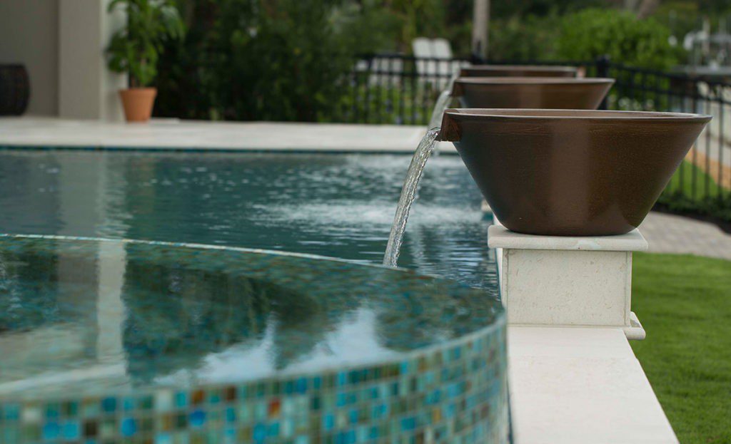 Pool Spillover Bowl-Tampa Custom Concrete Pros-We offer custom concrete solutions, Polished concrete, Stained concrete, Epoxy Floor, Sealed concrete, Stamped concrete, Concrete overlay, Concrete countertops, Concrete summer kitchens, Driveway repairs, Concrete pool water falls, and more